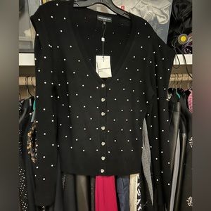 Generation love sweater with rhinestones and pearls. Size medium.